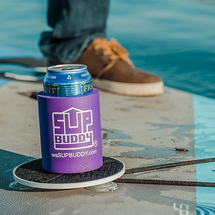 Zoomed in photo of a purple SUPBUDDY Koozie on a Stand Up Paddleboard in the water - BUOY WEAR